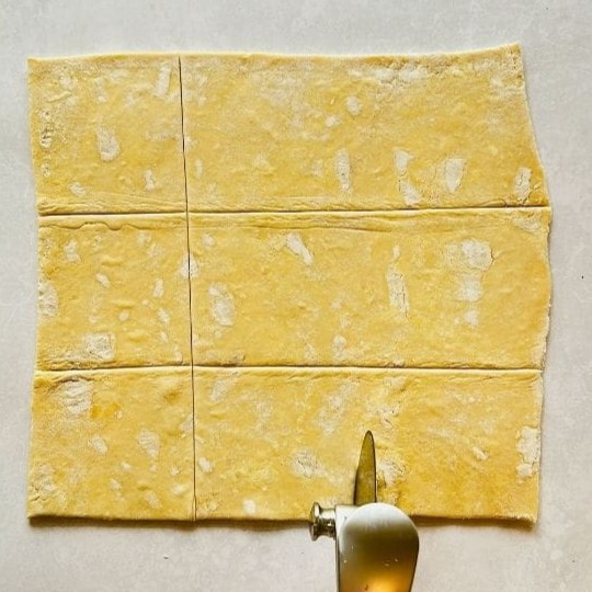 Cutting pastelitos into even pieces